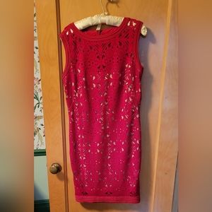 Red fully lined "cut-out" dress. Pegged pleated hemline. Altered to size 12.